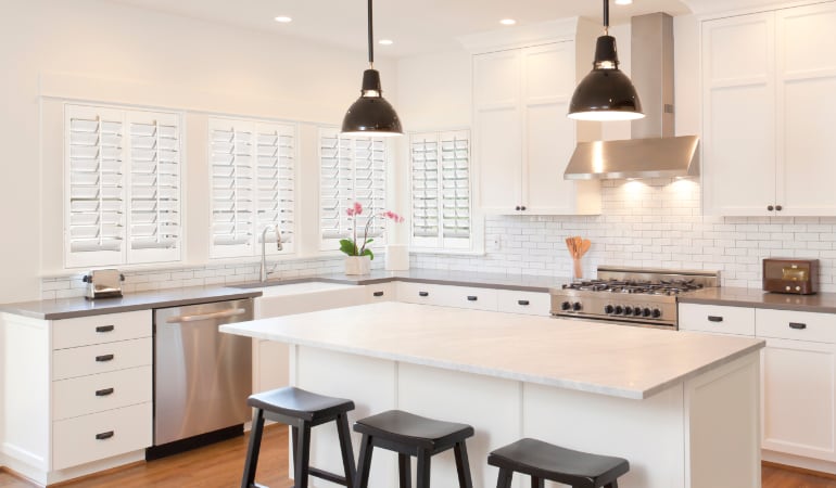 Plantation shutters in a bright Honolulu kitchen.